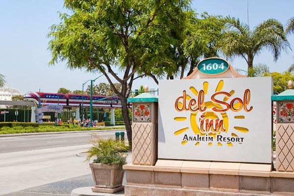 View of the Sign entering the Del Sol Inn Anaheim with Monorail passing by across the street 600