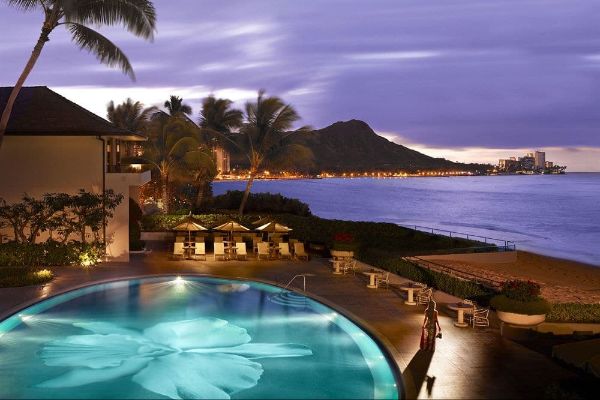 View of the incredible oval heated pool from a lanai overlooking Diamond Head at the Halekulani Hotel 600