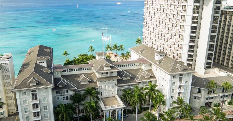 View of the front entrance to the Moana Surfrider Hotel in Waikiki Aerial 960