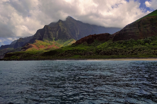 View of the Coast of Hawaiian Islands from the Water with a huge Mountain Backdrop 600