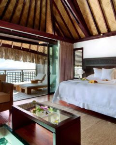 View of a luxury bungalow at hilton in Moorea Bedroom overlooking the lagoon 400