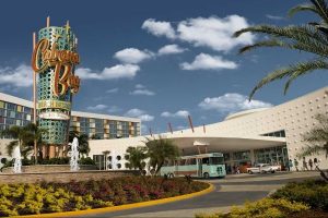 View of Cabana Bay Beach Resort Entrance with a Shuttle Bus in the front 600
