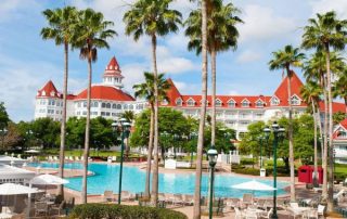 View of the back of Disney Grand Floridian over the large pool area 600