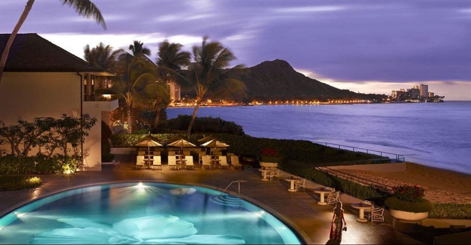 View of the incredible oval heated pool from a lanai overlooking Diamond Head at the Halekulani Hotel 960