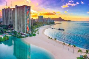 View of the Rainbow Tower beside the private lagoon at the Hilton Hawaiian Village in Waikiki Honolulu 600