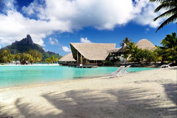 View of the Restaurant across the Lagoon with Mountain Background Le Meridien Resort in Bora Bora 600