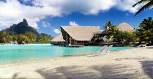 View of the Restaurant across the Lagoon with Mountain Background Le Meridien Resort in Bora Bora 960