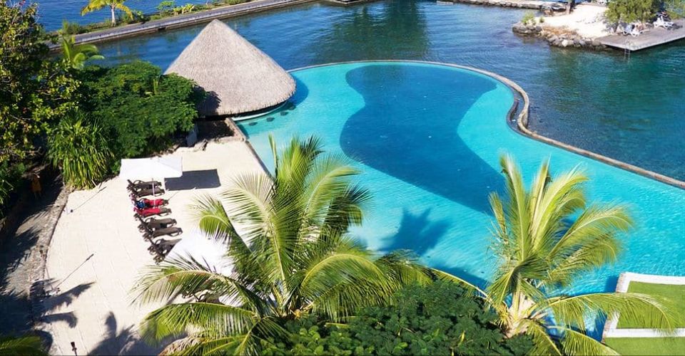 View of the Beach surrounding the Infinity Pool at the Manava Suite Resort Tahiti 960