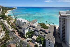 View of the front entrance to the Moana Surfrider Hotel in Waikiki Aerial 600