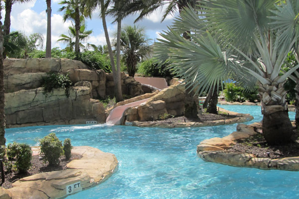 Water Slide and Lazy River at the Reunion Resort Converging at the Water Park in Orlando Fl 600